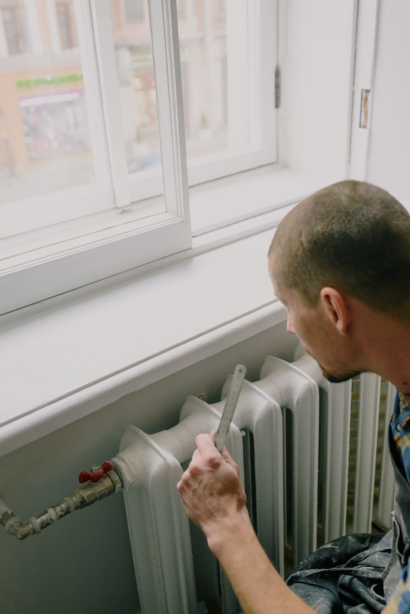 Real technician servicing residential hot-water heating equipment.