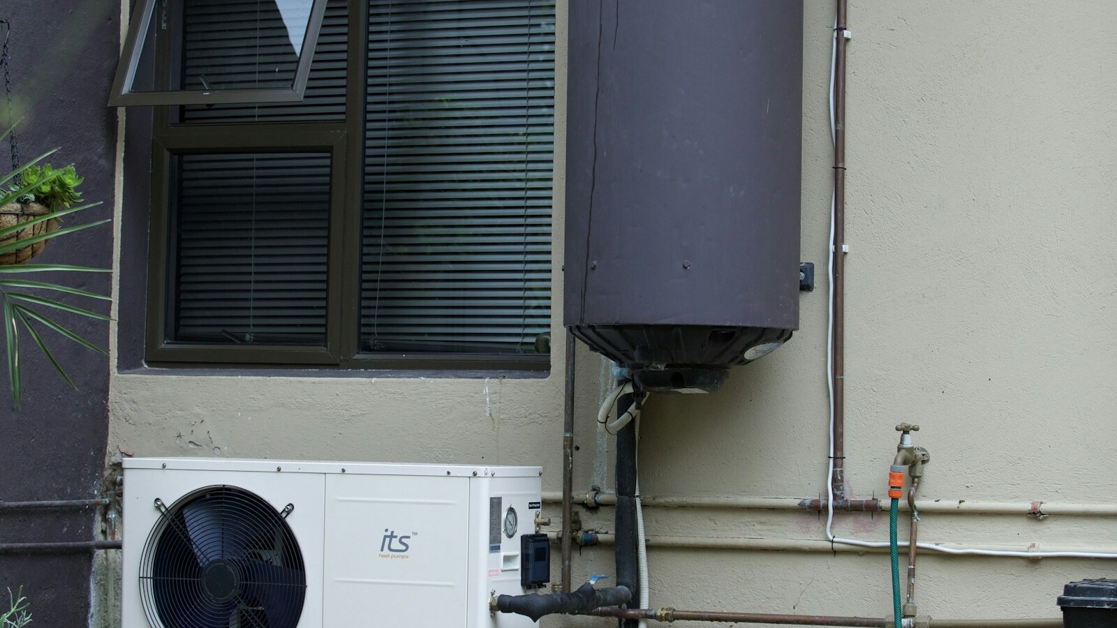Real residential water-heater installation and utility connections.